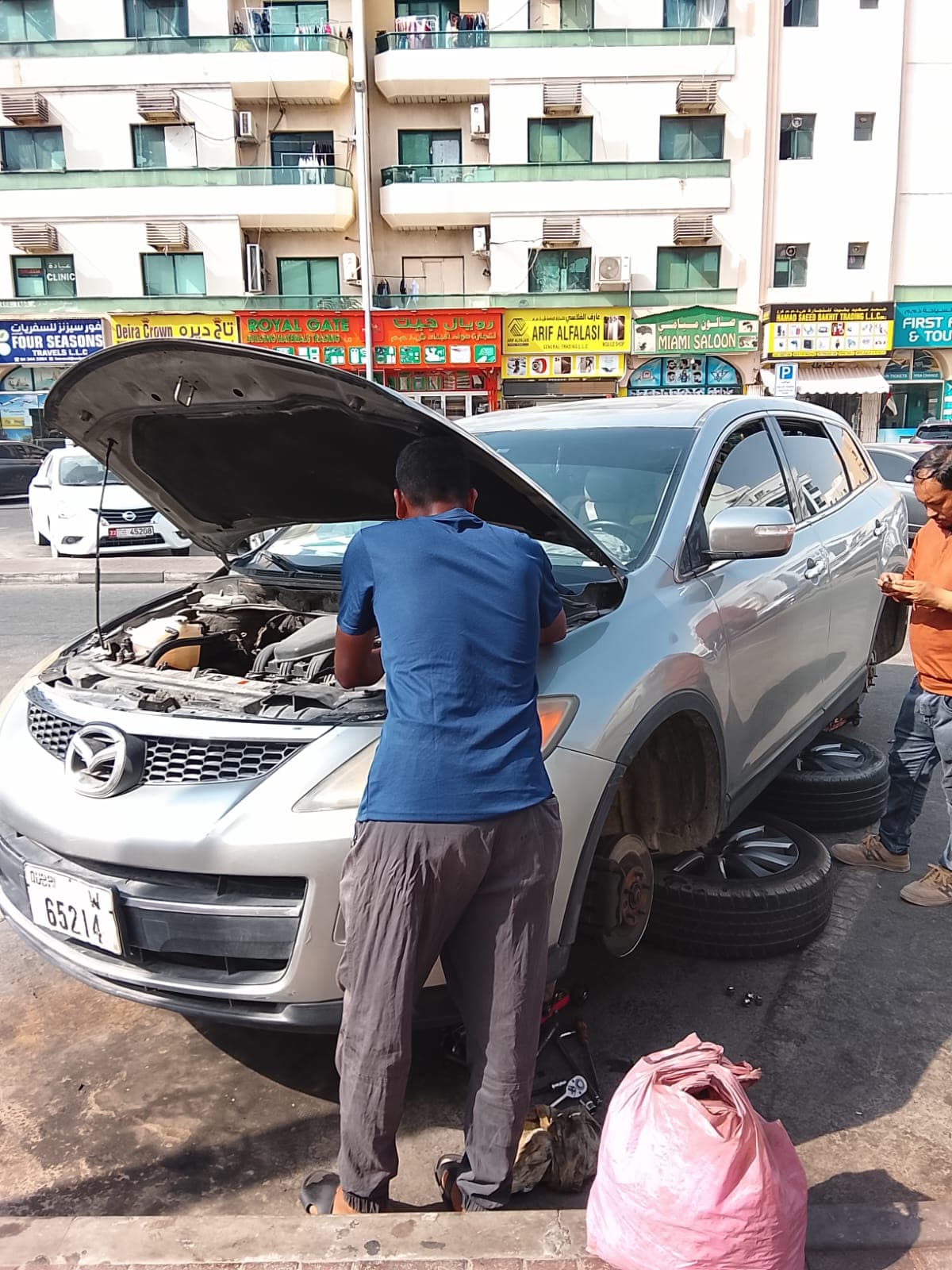Roadside tyre and brake job on a Mazda CX-9 in Deira