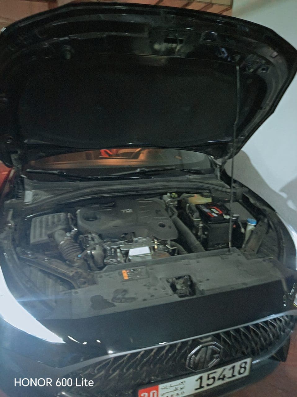 Engine bay open for inspection on a customer's vehicle