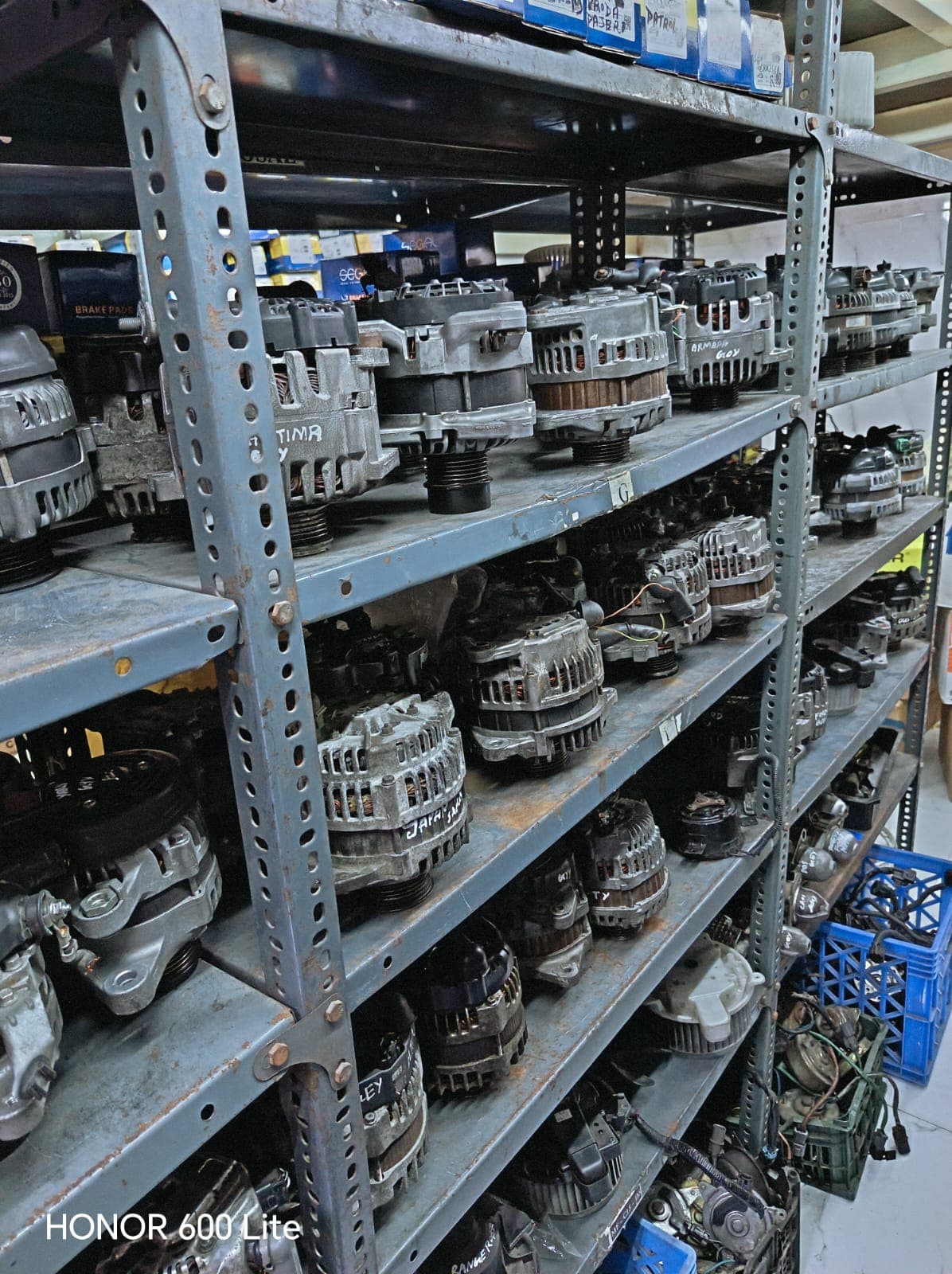 Warehouse shelving stocked with reconditioned alternators