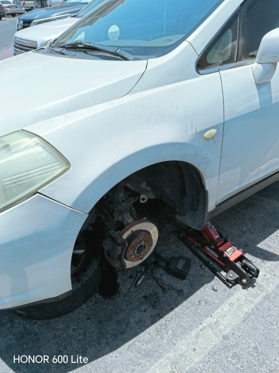 Wheel removed roadside for brake disc inspection